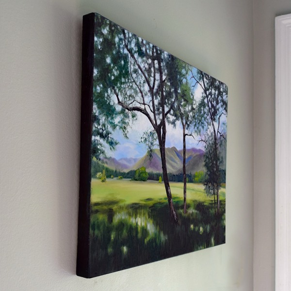 Edge of Into the Light — the dark, stained wood the panel is self-framed with
